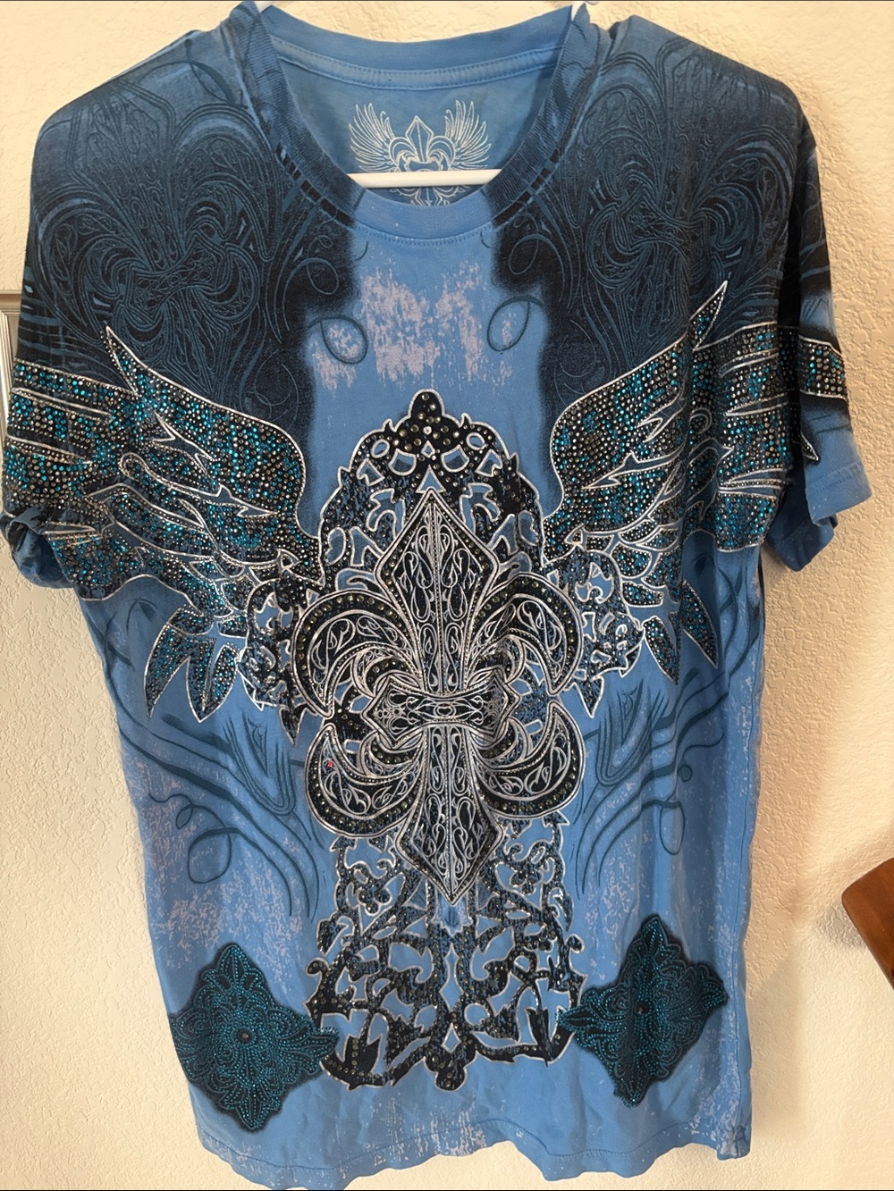 Blue Xzavier graphic T shirt accented with rhinestones
